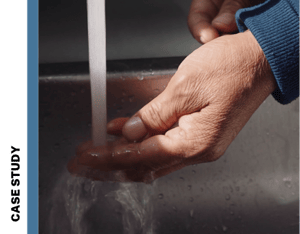 Water faucet pouring clean water on hands