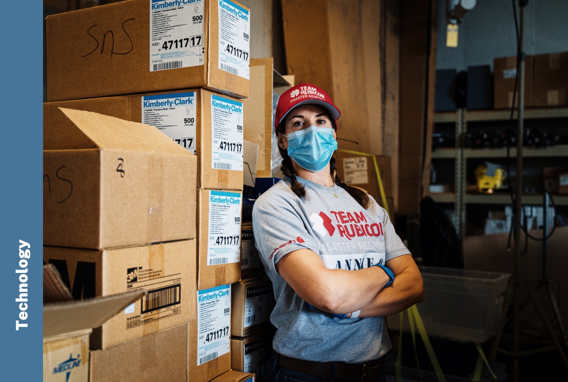 Technology: A Team Rubicon volunteer organizes disaster response materials in a warehouse.