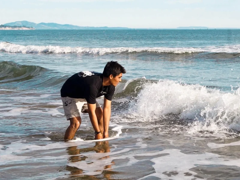 A teenage boy in the waves
